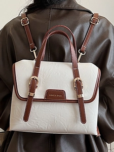 Retro Korean style large white messenger bag with brown straps worn on a brown leather jacket