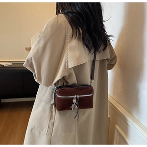 Brown suede crossbody bag with vintage silver zipper and unique metal robot charm