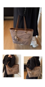 Brown vintage textured tote bag detail featuring a funny plush monster charm on handle