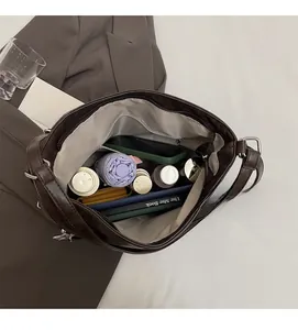 Close-up of the spacious interior of this dark brown tote showing multiple storage pockets