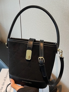 Retro black bucket bag with quilted suede and smooth leather details with top handle