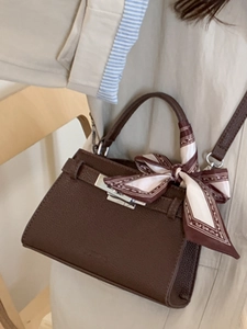 Brown lychee leather crossbody bag with silver twist lock and patterned scarf