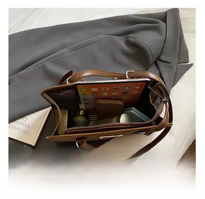 Internal view showing large capacity storage with striped lining for commuting tote bag