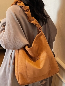 Fashionable orange suede hobo bag with large capacity and unique pleated shoulder strap