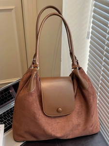 Brown high-capacity commuter tote backpack with a vintage dual-material patchwork design