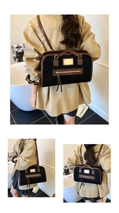 Detail of vintage matte backpack showing black suede texture and brown leather stitching