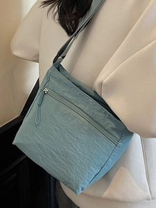 Minimalist light blue crinkle canvas crossbody bag with adjustable strap for women