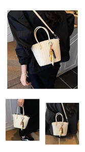 Detail of woven beige tote bag with wooden beads and adjustable shoulder strap