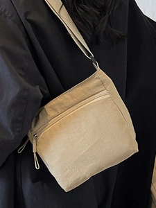 Fashionable beige washed canvas crossbody bag for women with adjustable shoulder strap