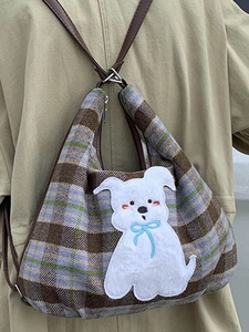 Plaid plush tote bag with cute dog embroidery and brown leather straps on casual model