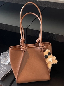 Brown litchi leather tote bag with knot handle and bear charm for women office use