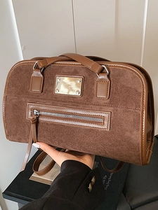Vintage brown frosted leather shoulder bag with sleek metal hardware for professional women