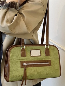 Retro avocado green suede shoulder bag with brown leather trim and metal detail