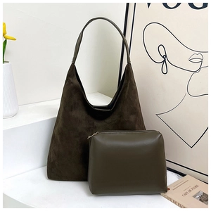 Detailed view of the large brown suede hobo bag with matching green leather pouch set