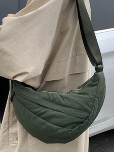 Green quilted half-moon crossbody bag for women with adjustable strap for daily commute