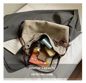 Top view of large khaki tote bag showing spacious interior with tablet and daily essentials