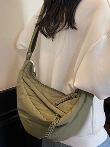 Olive green crescent dumpling bag with adjustable strap and textured nylon fabric