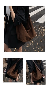 Detail showing the large capacity coffee brown suede hobo tote bag in a city street setting