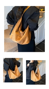 Detail view of the brown suede hobo tote showing large capacity and soft texture