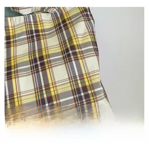 Close-up of high-quality yellow and brown plaid canvas fabric on a large tote bag