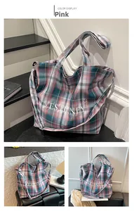 Detail of pink plaid canvas tote with YES HONEY embroidery and adjustable straps