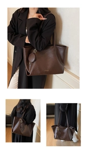 Detail view of large dark brown tote bag with removable round coin purse and matte leather