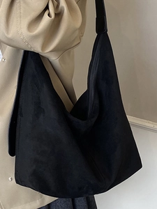 Minimalist black suede hobo tote bag for women with wide strap for casual commuting
