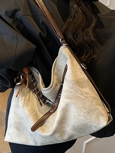 Retro oversized canvas hobo bag in beige with dark brown leather strap and metal eyelets