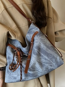 Retro high-capacity blue denim tote bag with leather straps and decorative charms