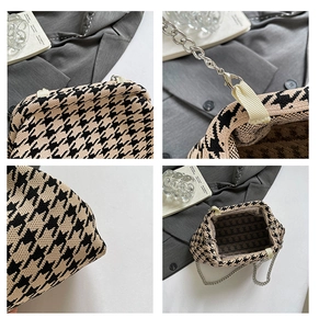 Detail view of houndstooth knit handbag with silver metal chain and textured interior