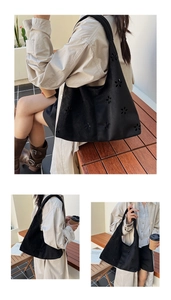 Detail of black laser-cut floral pattern on matte suede hobo tote bag for women