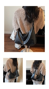 Detail of black large capacity tote bag with soft pleated design and cute brown bear charm