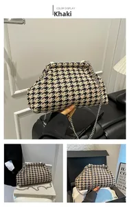 Detail of khaki houndstooth knitted cloud bag with vintage metal frame and chain strap