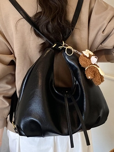 Retro black faux leather slouchy tote bag with zipper and cute brown bear pendant
