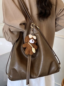 Retro large brown faux leather tote bag with plush bear charm and long shoulder strap