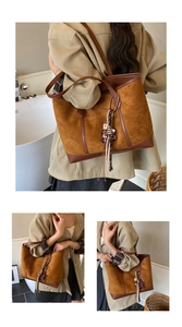 Dettaglio della borsa tote in pelle scamosciata marrone con finiture e sciarpa di seta