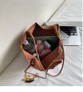 Detail view of large woven tote bag interior showing ample storage space for daily essentials