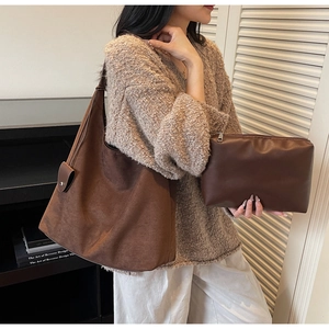Brown suede-texture hobo shoulder bag and matching zipper pouch combo set shown in detail