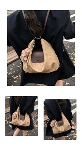 Detailed view of vintage pleated tote bag featuring leather flap and teddy bear charm