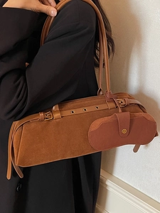 Vintage brown suede underarm bag for women with leather trim and a hanging pouch