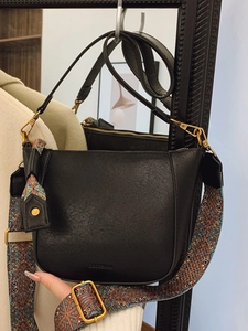 Retro black leather bucket bag with bohemian wide strap and golden metal hardware