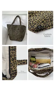 Détails du sac cabas léopard avec nœud en strass et doublure intérieure spacieuse