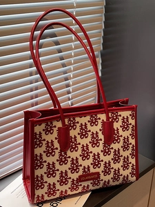 Red and beige festive tote bag with traditional Chinese double joy patterns and leather handles