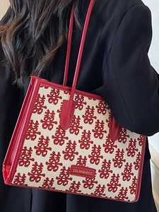 Festive red and beige jacquard tote bag with traditional pattern and leather handles