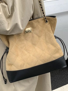 Vintage quilted suede bucket bag in khaki and black with gold chain shoulder strap