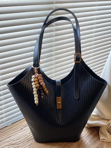 Large black woven shoulder tote bag with vintage lock and colorful bead ornament
