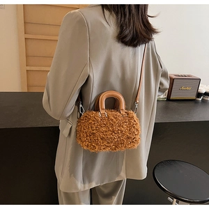 Chic brown fuzzy lamb wool mini Boston bag shown on a model for a stylish autumn look