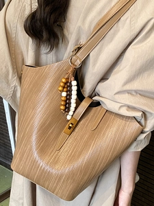 Chic brown woven texture large tote bag for women with wooden bead charm and long strap
