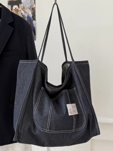 Large capacity dark blue denim tote bag with contrast stitching and shoulder strap