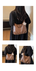 Detailed view of brown lychee grain hobo bag with a cute white lamb plush pendant charm